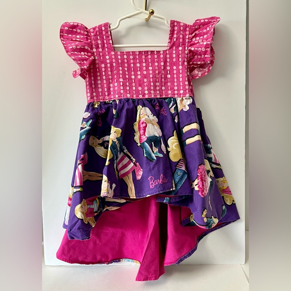 Barbie handmade dress. The size isn’t on the tag, measurements are in photos.